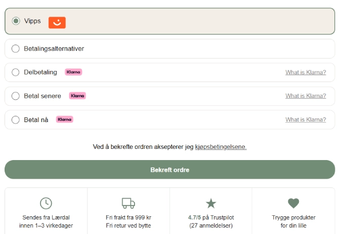 The payment step in the VuggeBaby checkout, with Vipps and Klarna as options, a confirm order button and a row of delivery guarantees below